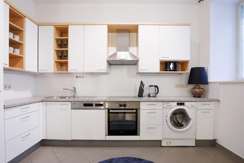 Kitchen or kitchenette, dishwasher, oven, stove, toaster, washing machine