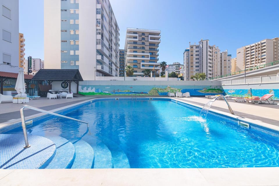 Property building, Living room, Swimming pool