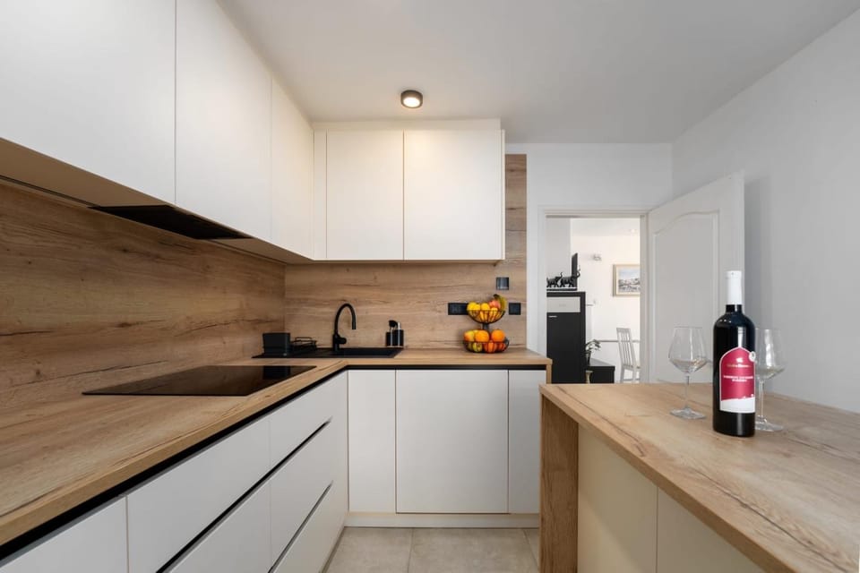 Kitchen or kitchenette, dishwasher, microwave, oven, stove