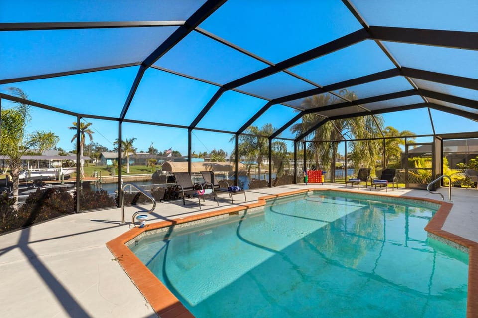 Electric heated pool on gulf access canal w/kayaks! Villa Jen - SWFL Rentals Villa in Cape Coral