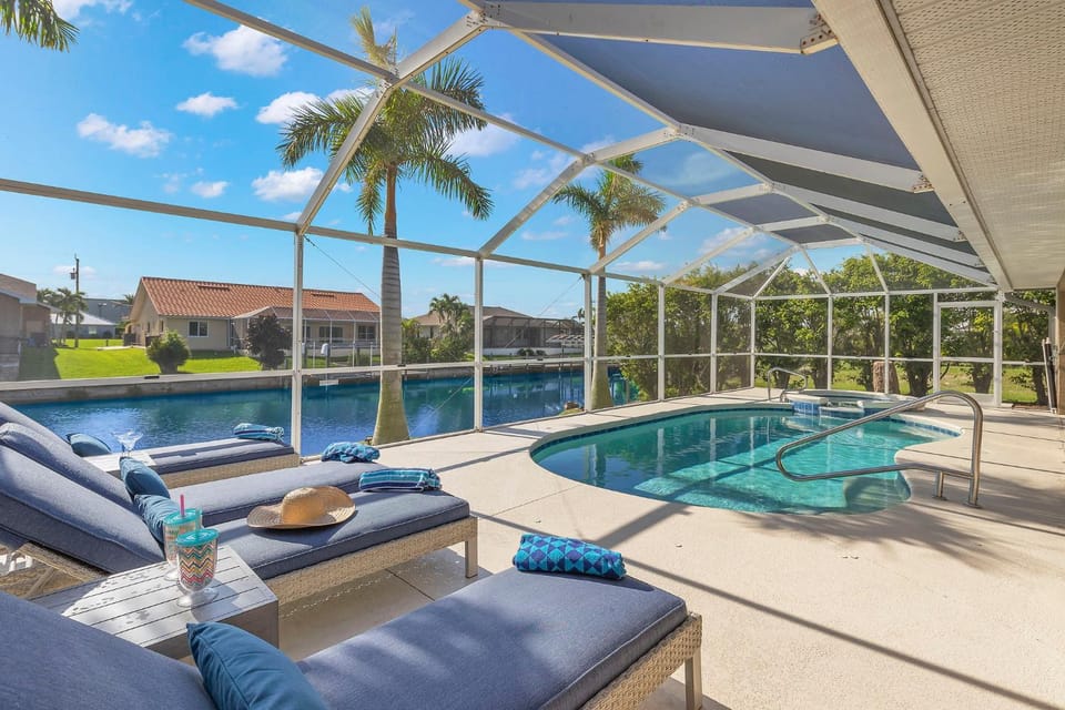 Great for kids! Paddle boards, bikes, kayaks & pet friendly! Villa Evelyn's Palms - SWFL Rentals Villa in Cape Coral