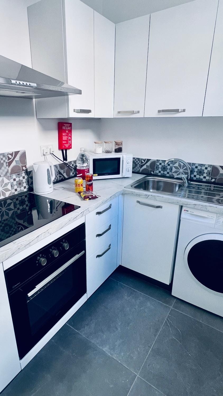 Kitchen or kitchenette, oven, stove, toaster