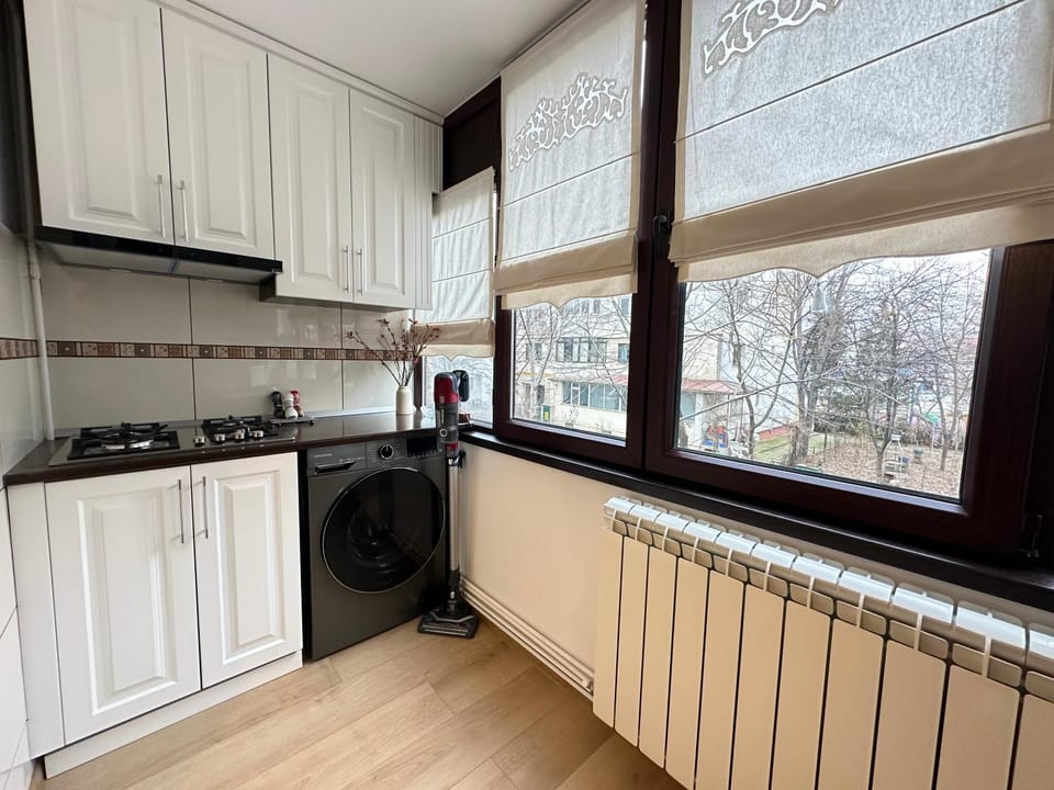 Kitchen or kitchenette, stove, washing machine