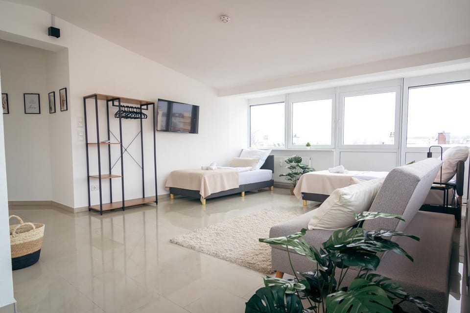 Bed, TV and multimedia, Seating area, wardrobe