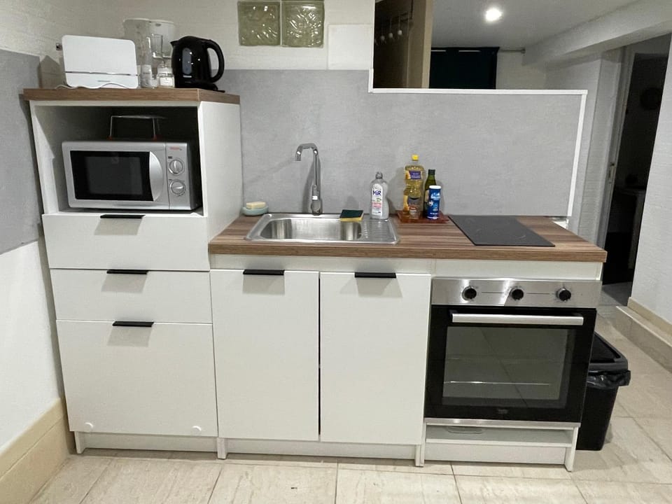 Kitchen or kitchenette, dishwasher, oven, stove, toaster