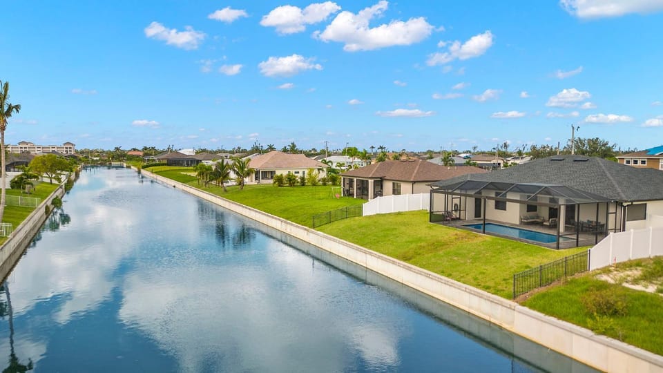 Family friendly, Sleeps 10! Electric saltwater pool & outdoor kitchen! Villa Lola - SWFL Rentals Villa in Cape Coral