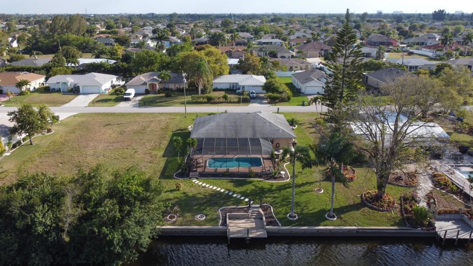 Great for families! Games & electric heated pool w/Gulf Access! Villa Mahana - SWFL Rentals Villa in Cape Coral