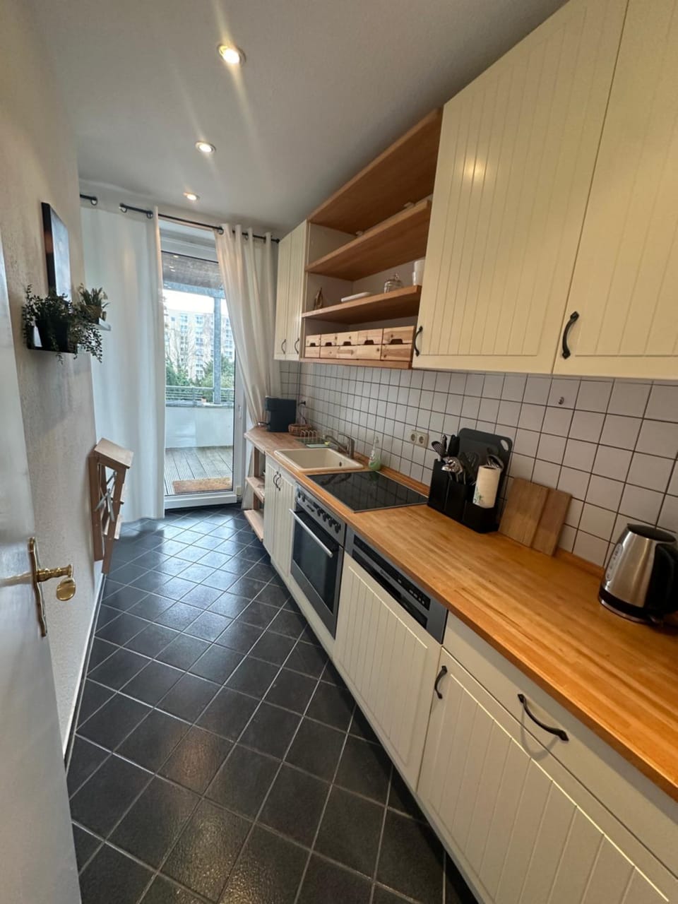 Kitchen or kitchenette, dishwasher, oven, stove