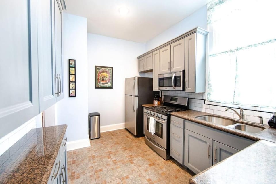 Kitchen or kitchenette, dishwasher, oven, stove