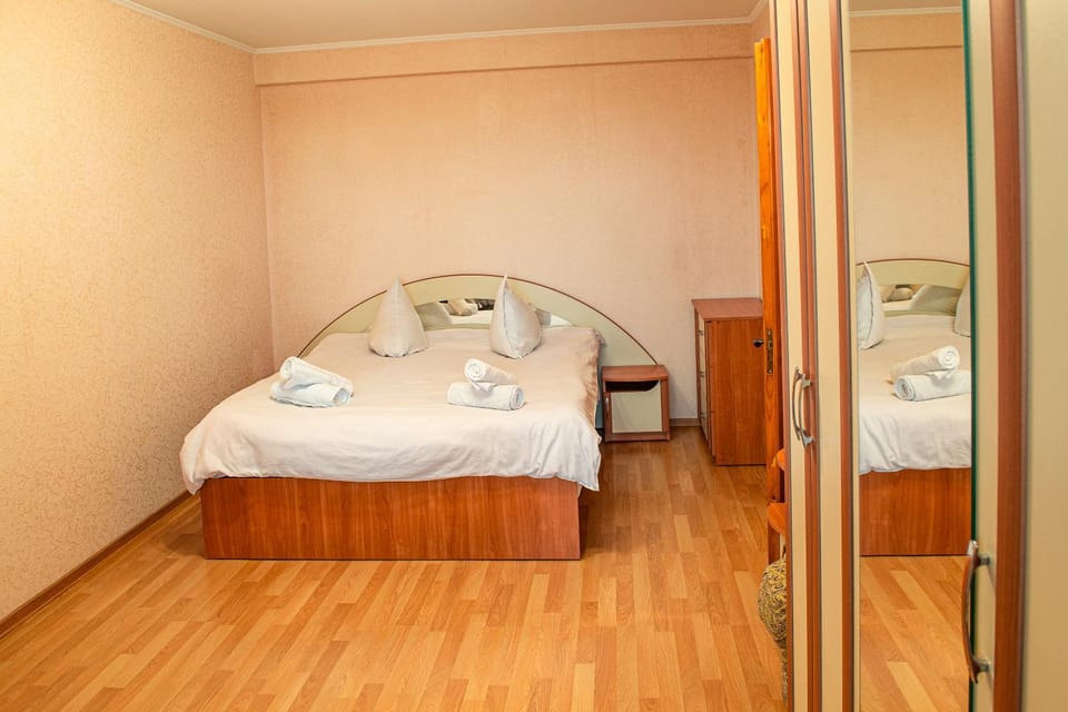 Bed, towels, wardrobe