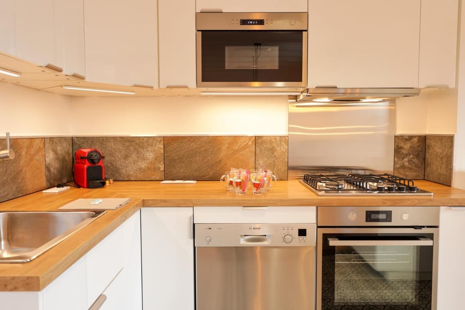 Kitchen or kitchenette, dishwasher, oven, stove, toaster