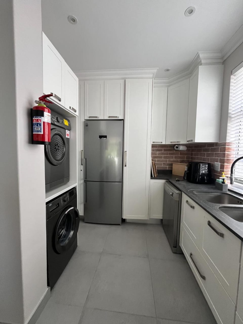 Kitchen or kitchenette, dishwasher, washing machine, dryer