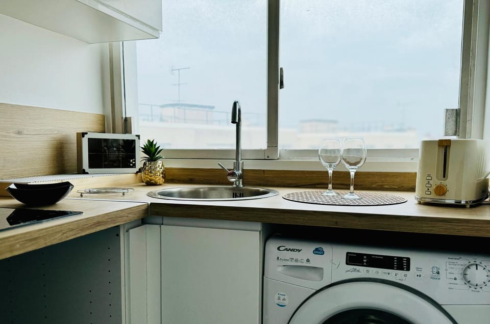 Kitchen or kitchenette, oven, stove, washing machine, dryer