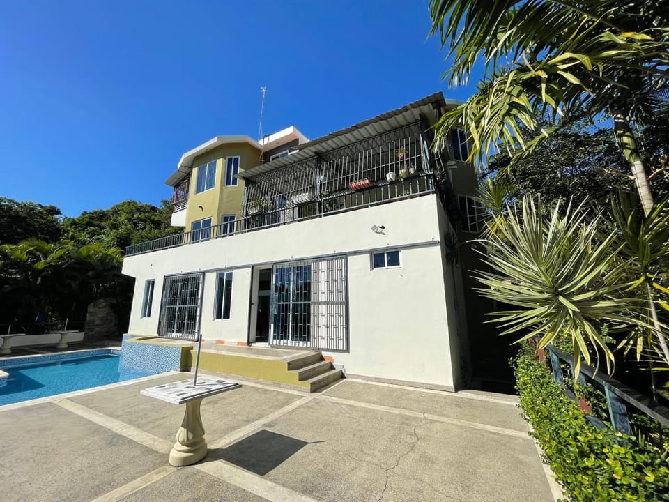 Property building, Patio, Pool view, Swimming pool, sunbed
