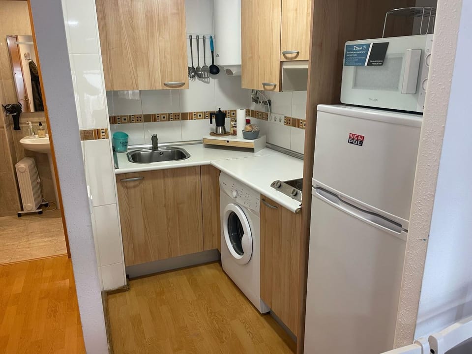 Kitchen or kitchenette, washing machine