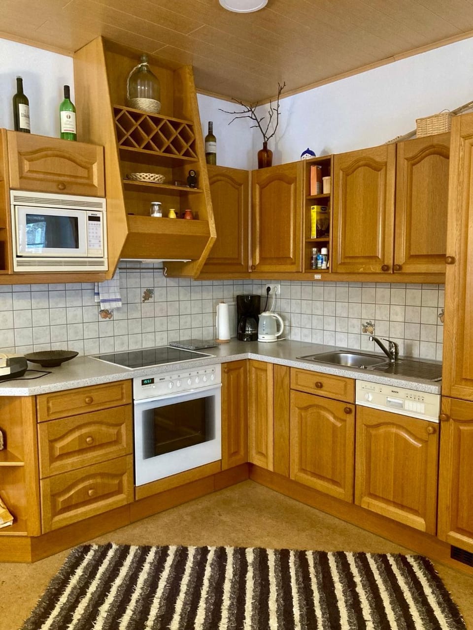 Kitchen or kitchenette, dishwasher, oven, stove, toaster