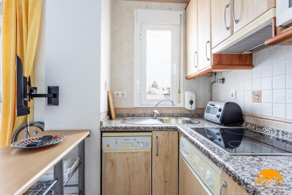 Kitchen or kitchenette, dishwasher, stove, toaster, washing machine, kitchen