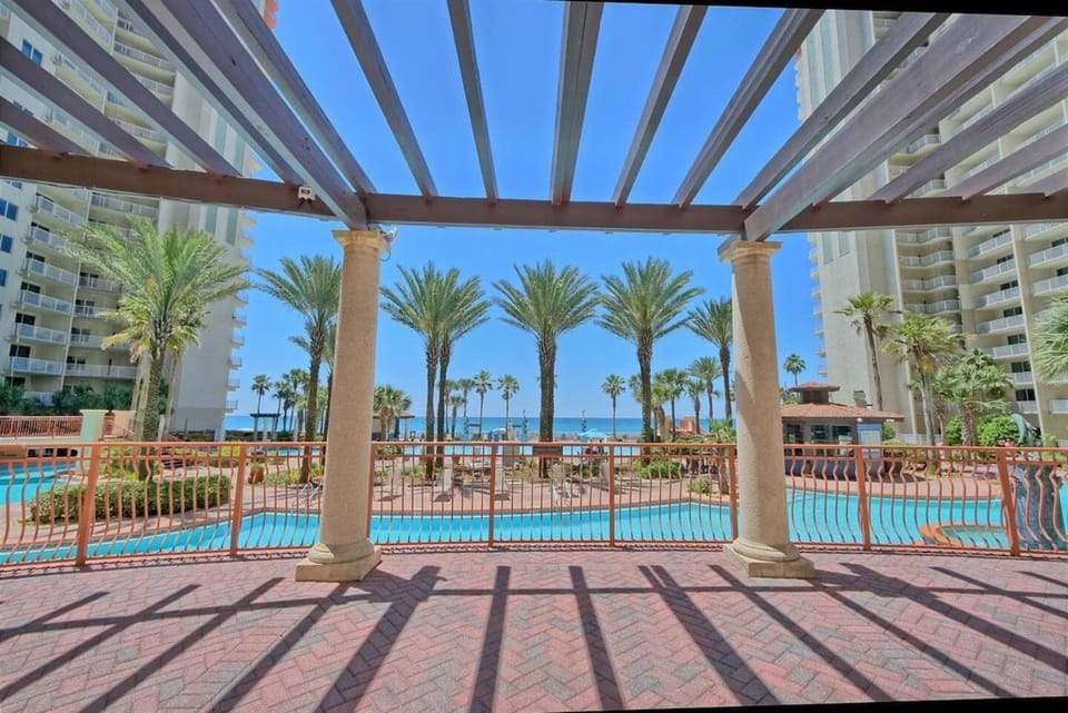 Property building, Patio, Pool view, Swimming pool, sunbed