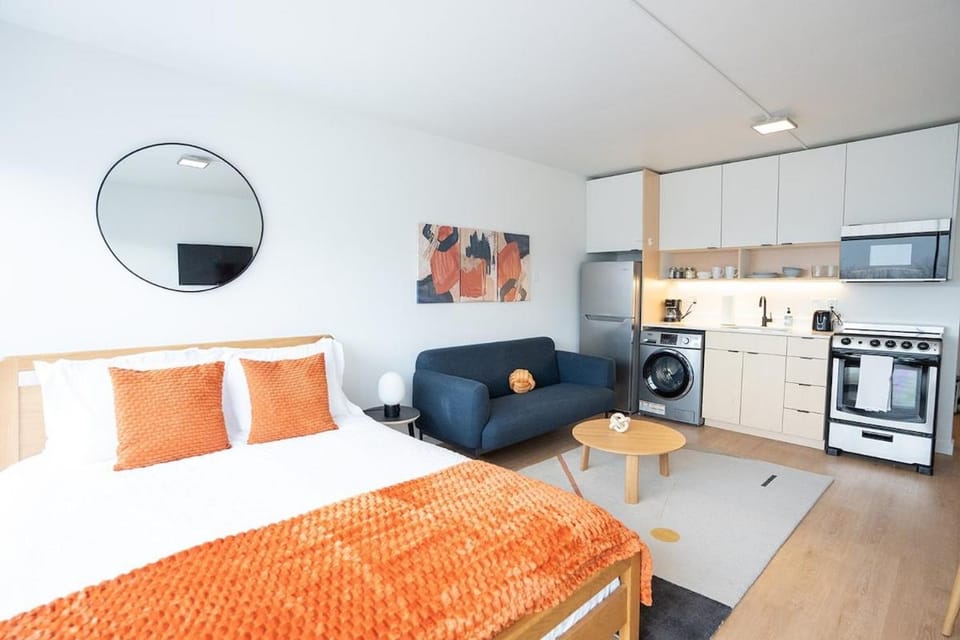 Bed, Living room, Seating area, oven, stove, toaster
