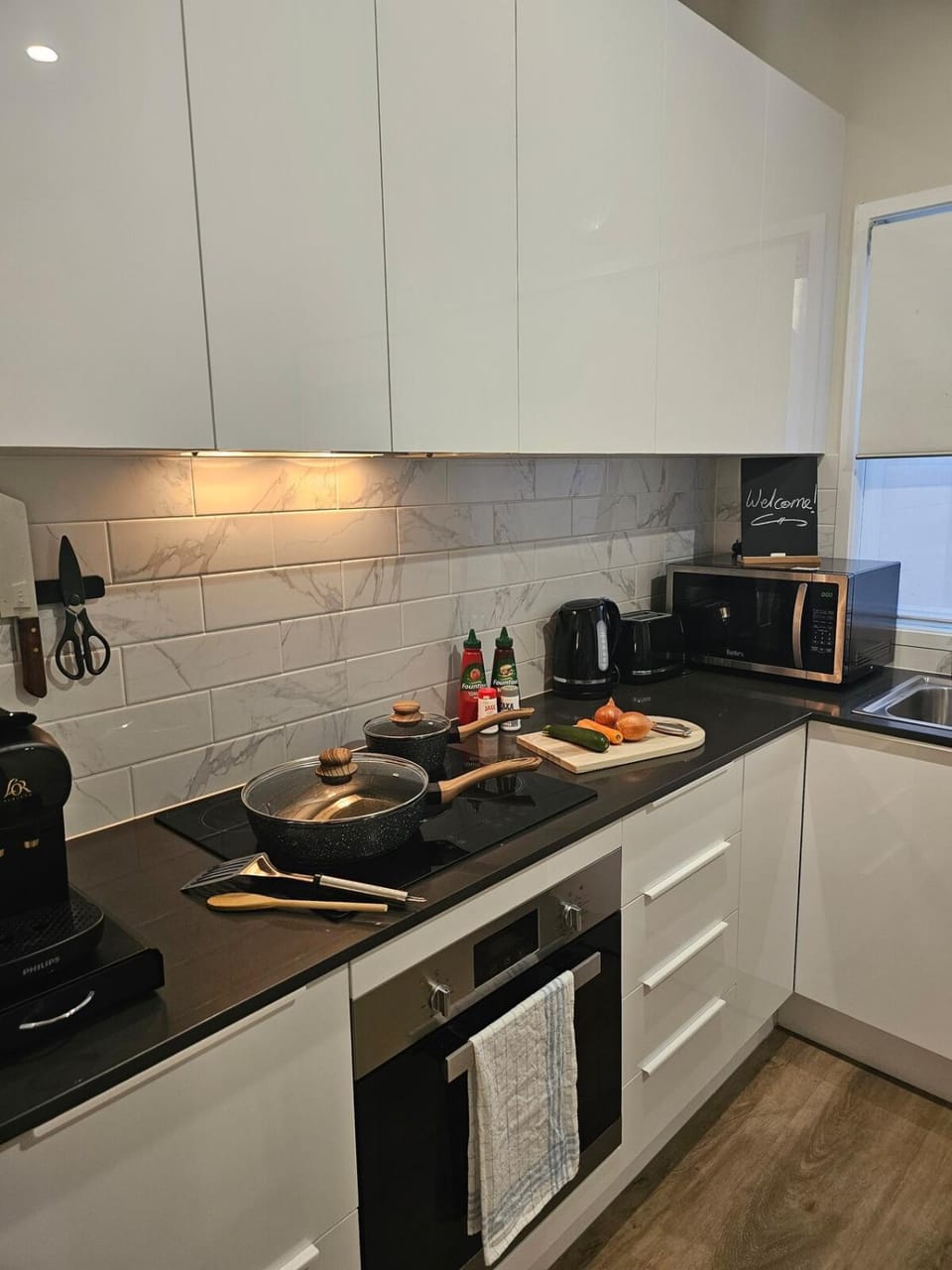 Kitchen or kitchenette, dishwasher, stove, toaster