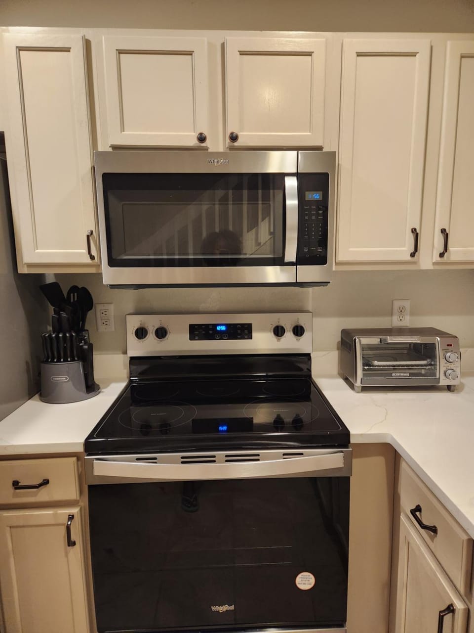 Kitchen or kitchenette, dishwasher, oven, stove, toaster