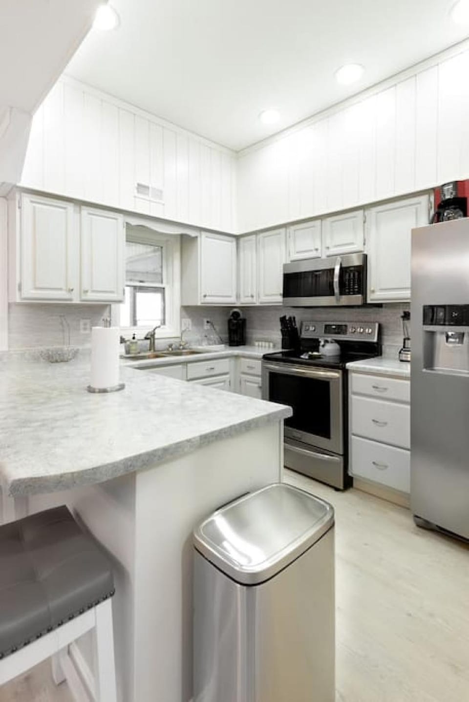 Kitchen or kitchenette, dishwasher, oven, stove, toaster