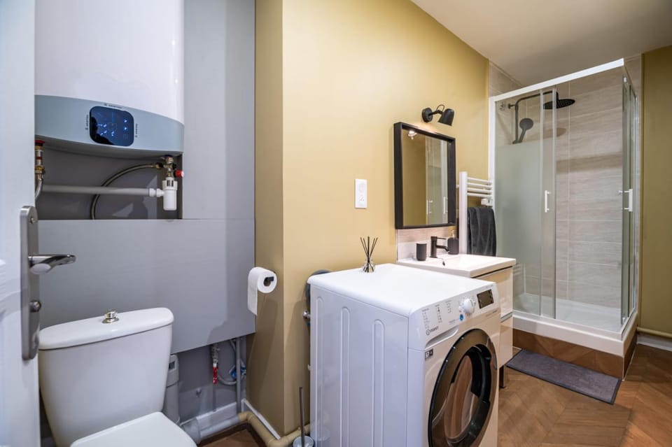 Shower, Toilet, Bathroom, hair dryier, towels, washing machine, dryer