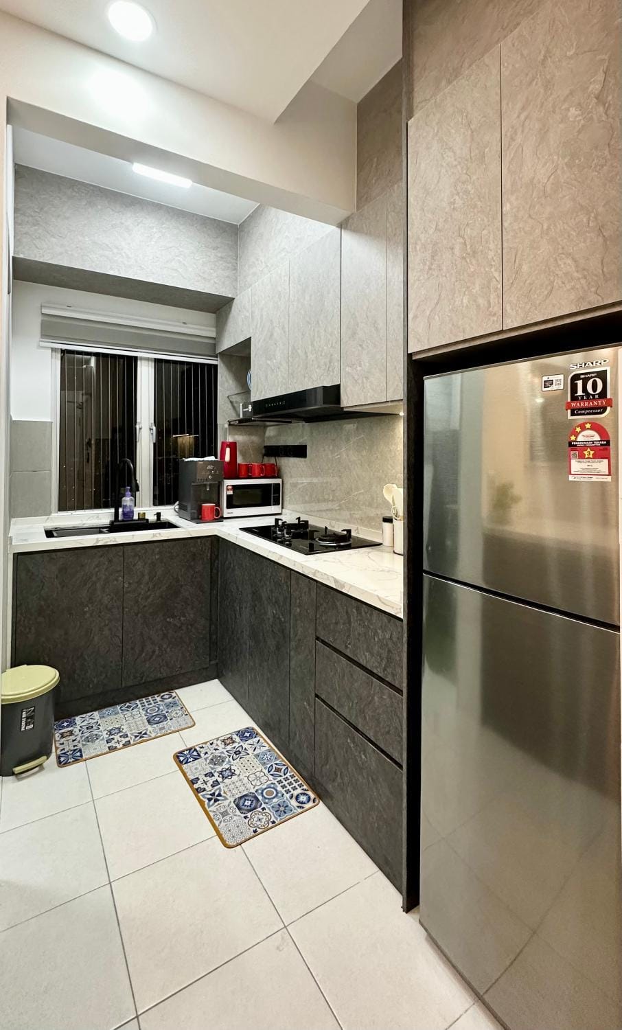 Kitchen or kitchenette, dishwasher, oven, stove