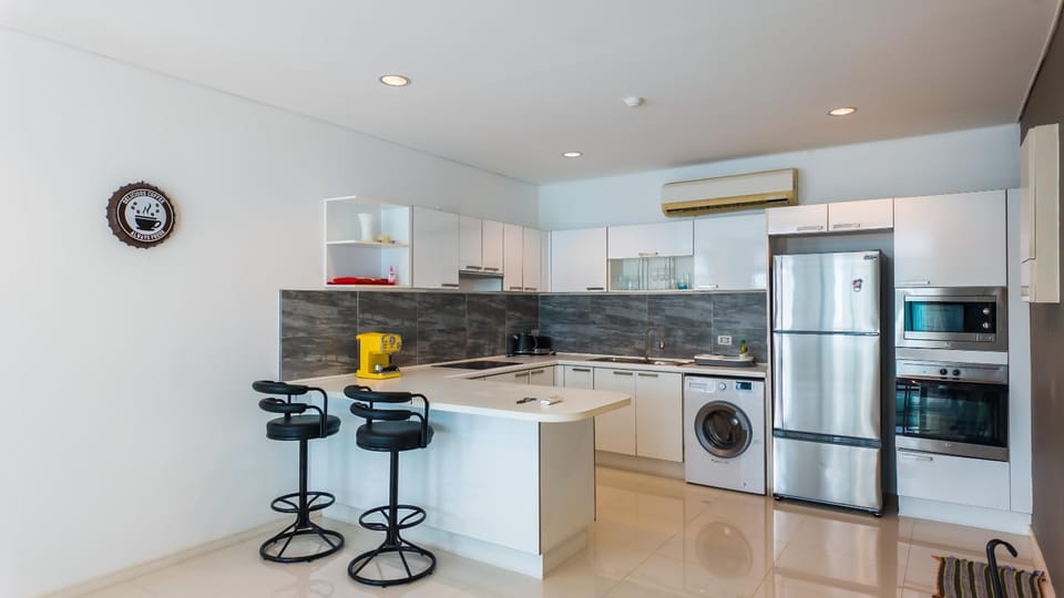 Kitchen or kitchenette, oven, stove, toaster, washing machine