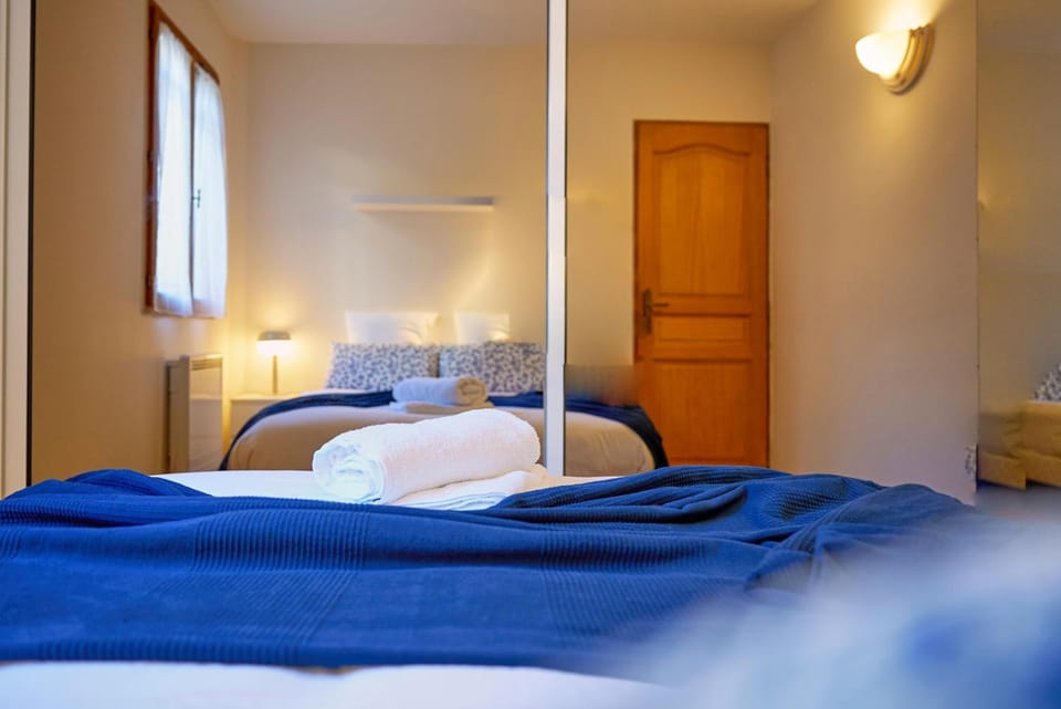 Bed, towels, wardrobe
