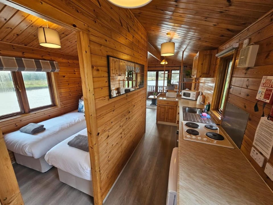 Hickling Broads Lodge Houseboat Max 4 Docked boat in Broadland District