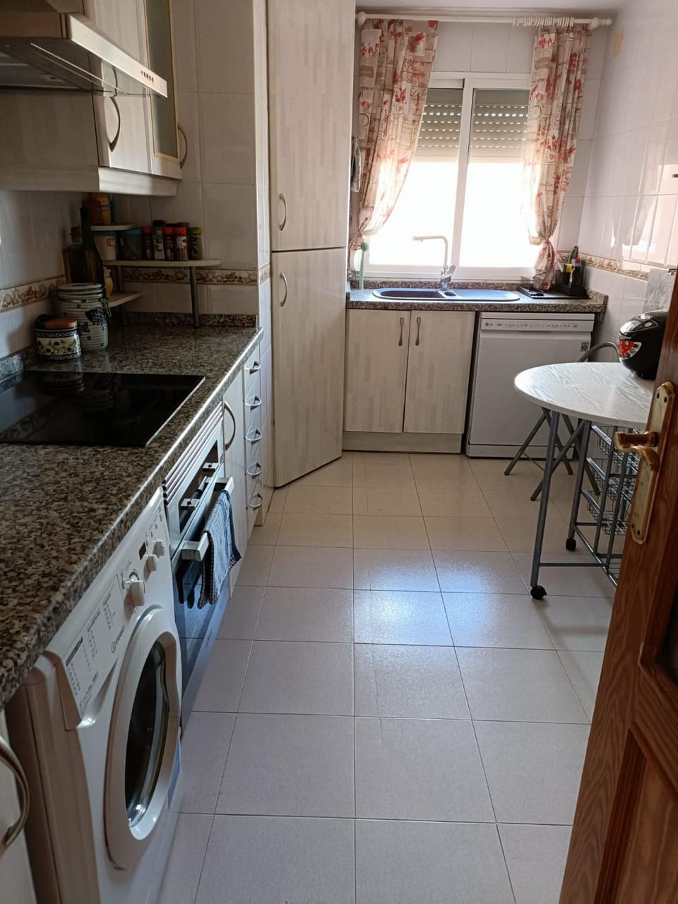 Kitchen or kitchenette, dishwasher, oven, stove, washing machine