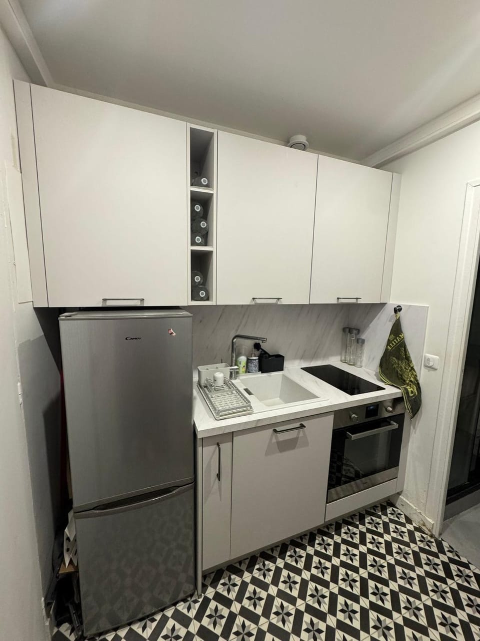 Kitchen or kitchenette, dishwasher, oven, stove