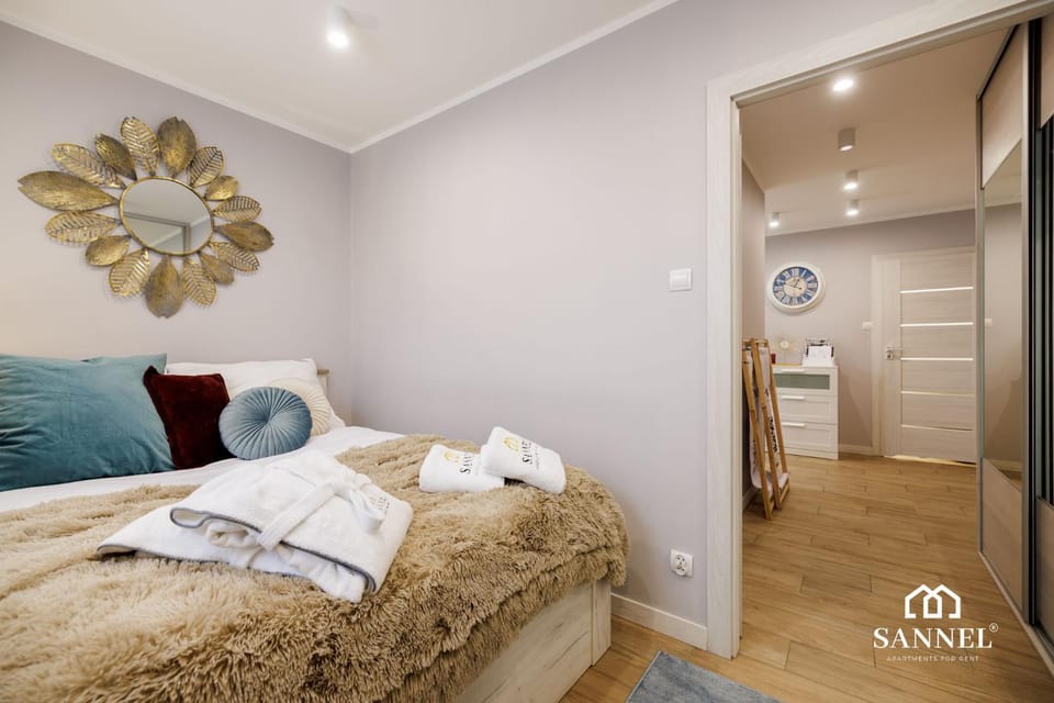 Bed, Property logo or sign, Photo of the whole room, Decorative detail, Decorative detail, Bedroom, towels, wardrobe