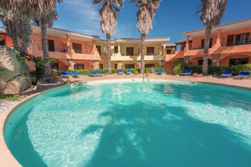 Property building, Patio, Pool view, Swimming pool, sunbed
