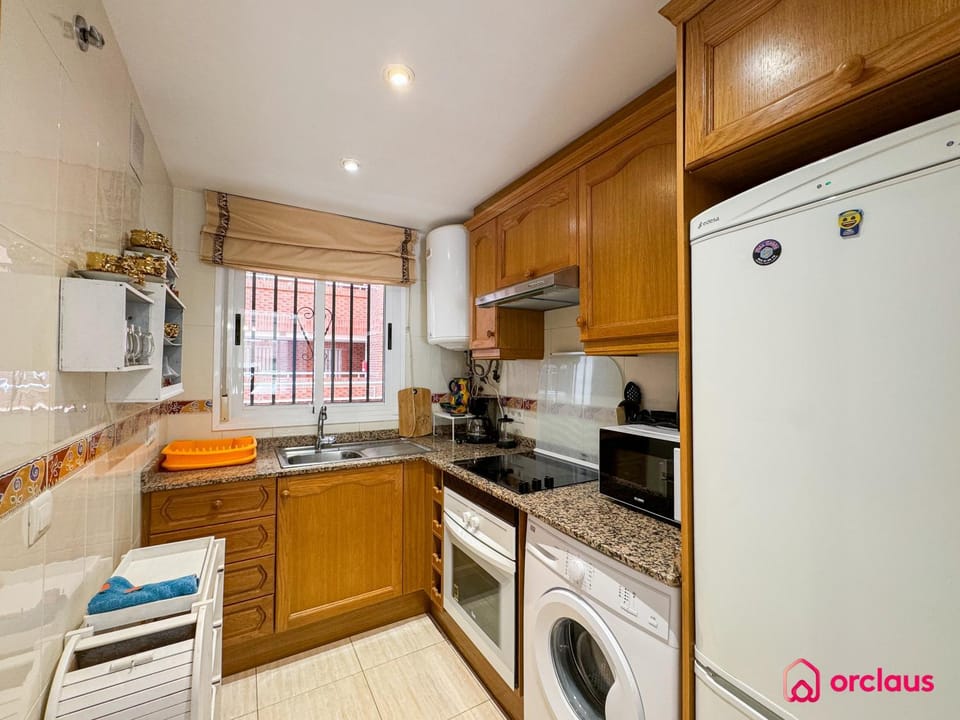 Kitchen or kitchenette, oven, stove, washing machine