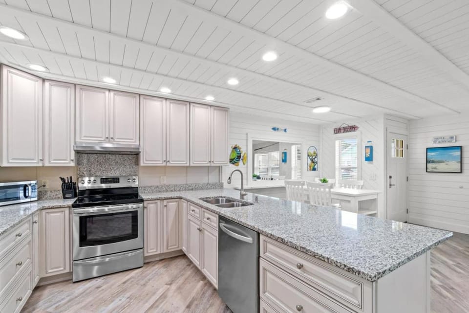 Kitchen or kitchenette, dishwasher, oven, stove, toaster