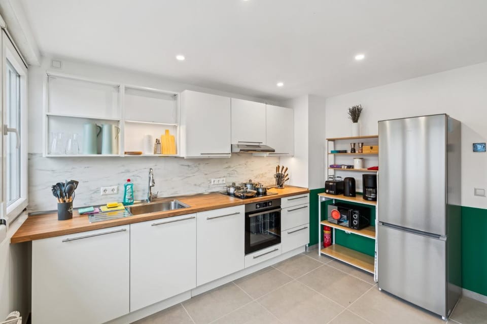 Kitchen or kitchenette, dishwasher, oven, stove, toaster