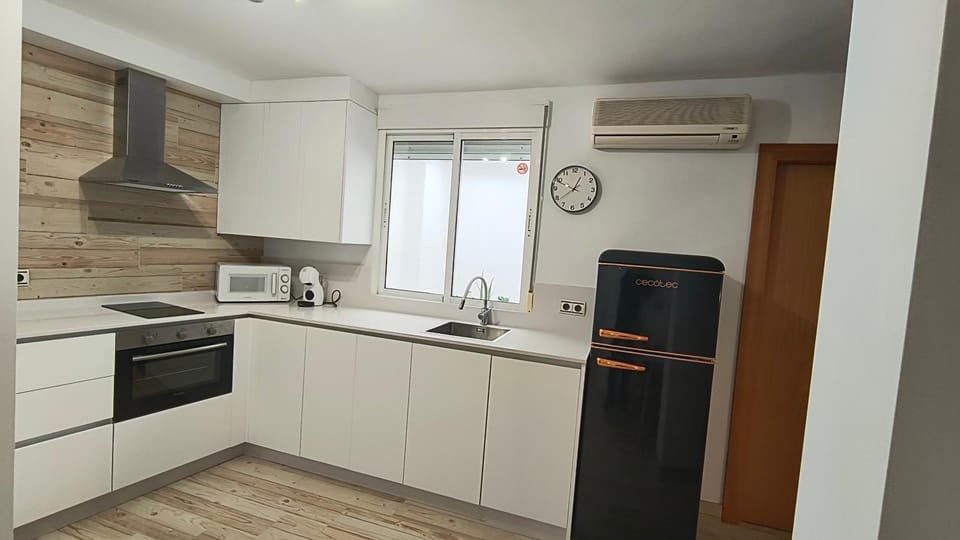 Kitchen or kitchenette, dishwasher, oven, stove