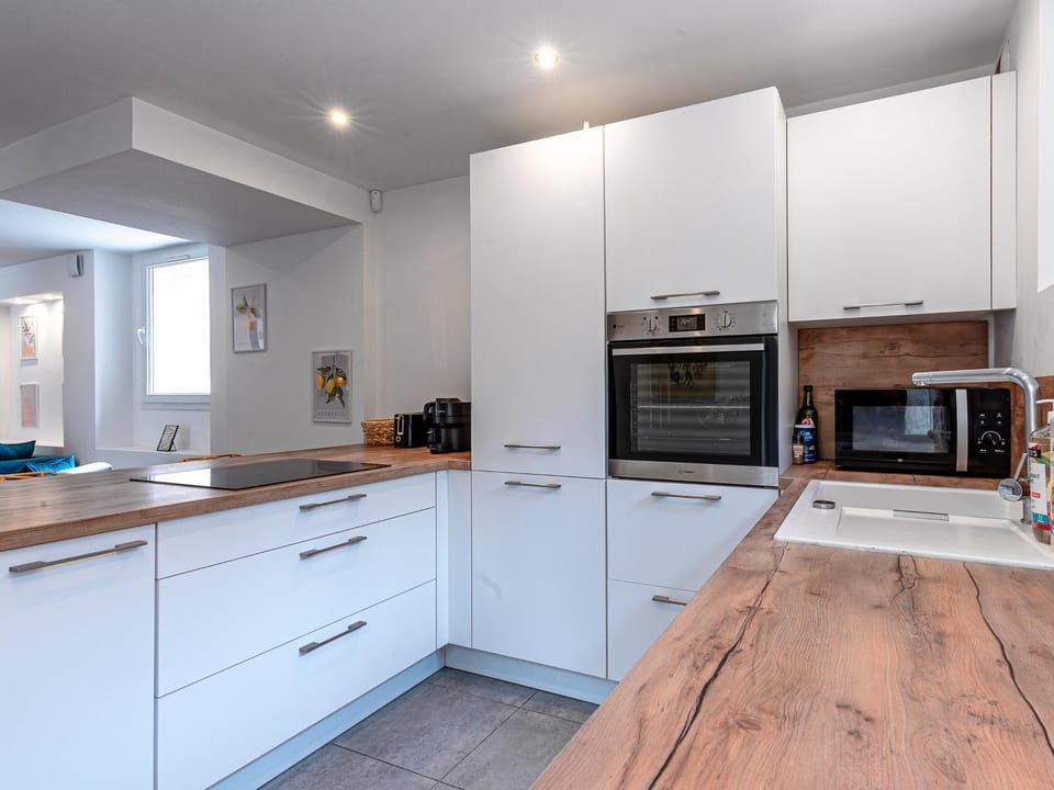 Kitchen or kitchenette, dishwasher, oven, stove, toaster