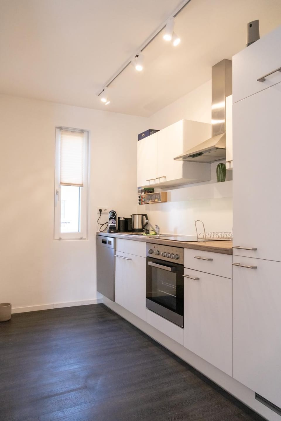 Kitchen or kitchenette, dishwasher, oven, stove