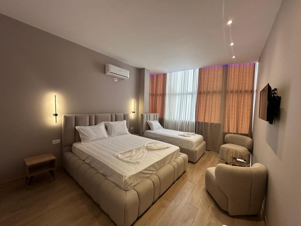 Bed, TV and multimedia, Seating area, Bedroom, air conditioner