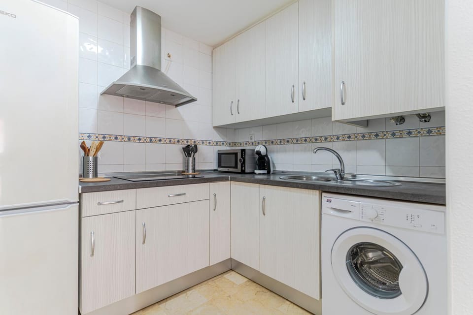 Kitchen or kitchenette, stove, washing machine
