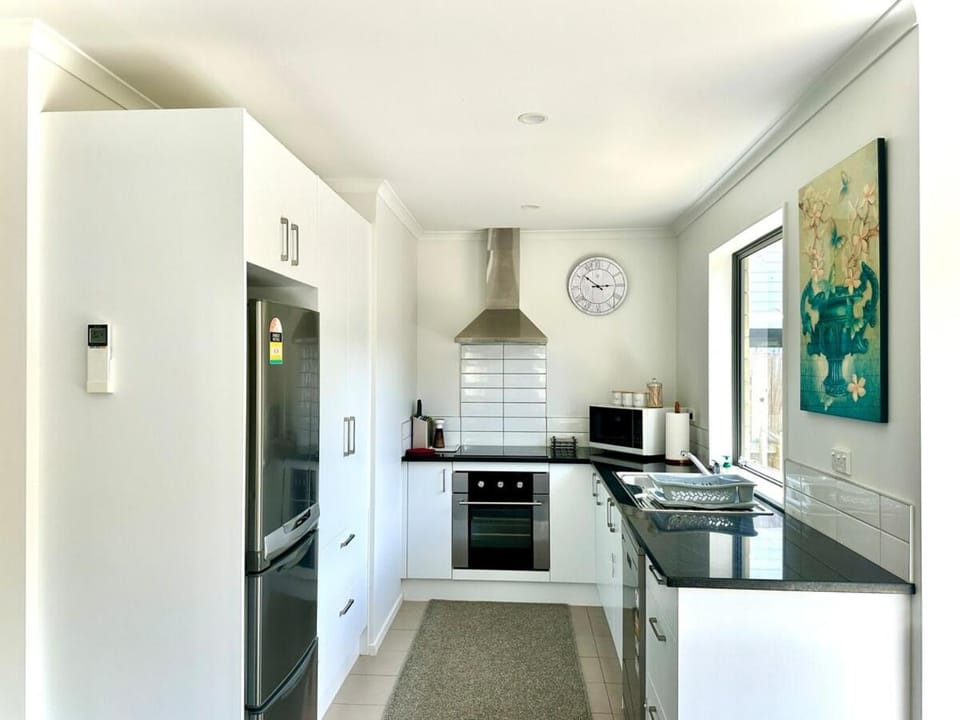 Kitchen or kitchenette, dishwasher, oven, stove