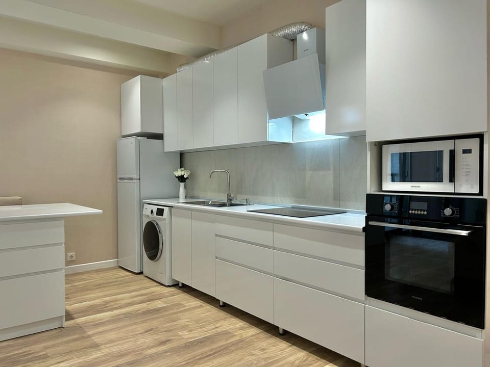 Kitchen or kitchenette, stove, washing machine