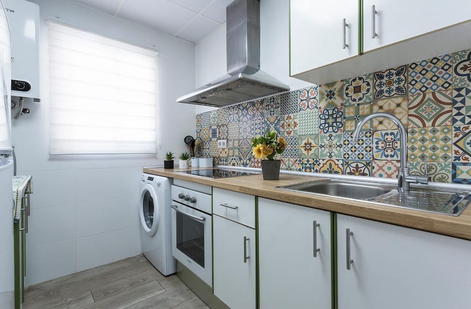 Kitchen or kitchenette, oven, stove, washing machine