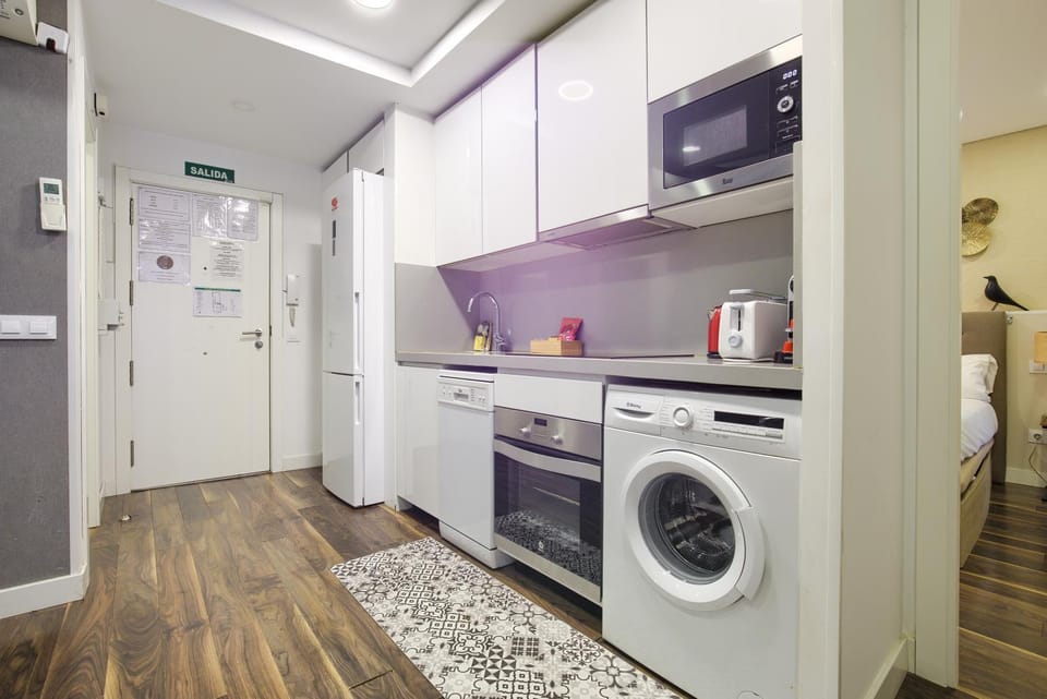 Kitchen or kitchenette, dishwasher, oven, stove, toaster, washing machine