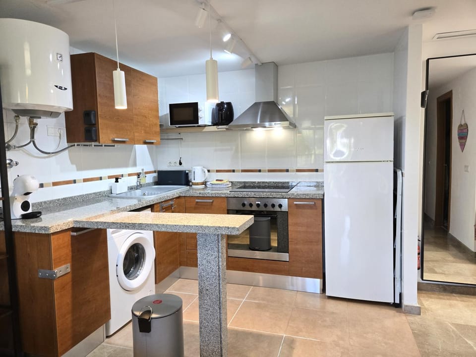 Kitchen or kitchenette, dishwasher, oven, toaster, washing machine