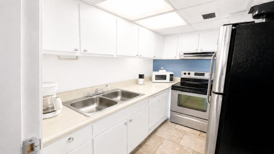 Kitchen or kitchenette, dishwasher, microwave, oven, stove, kitchen