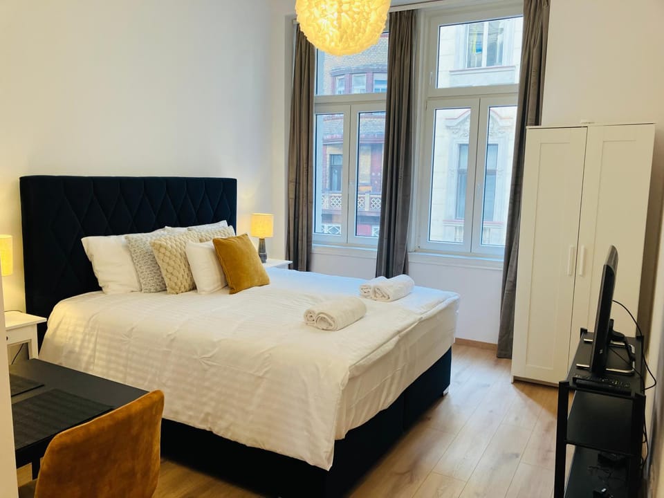 Bed, TV and multimedia, Bedroom, towels, wardrobe